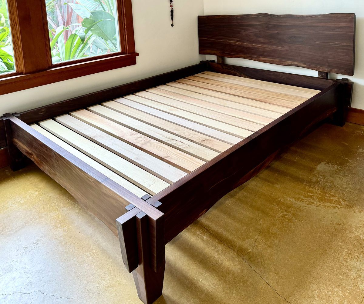 Solid walnut platform bed frame with sculpted joinery
