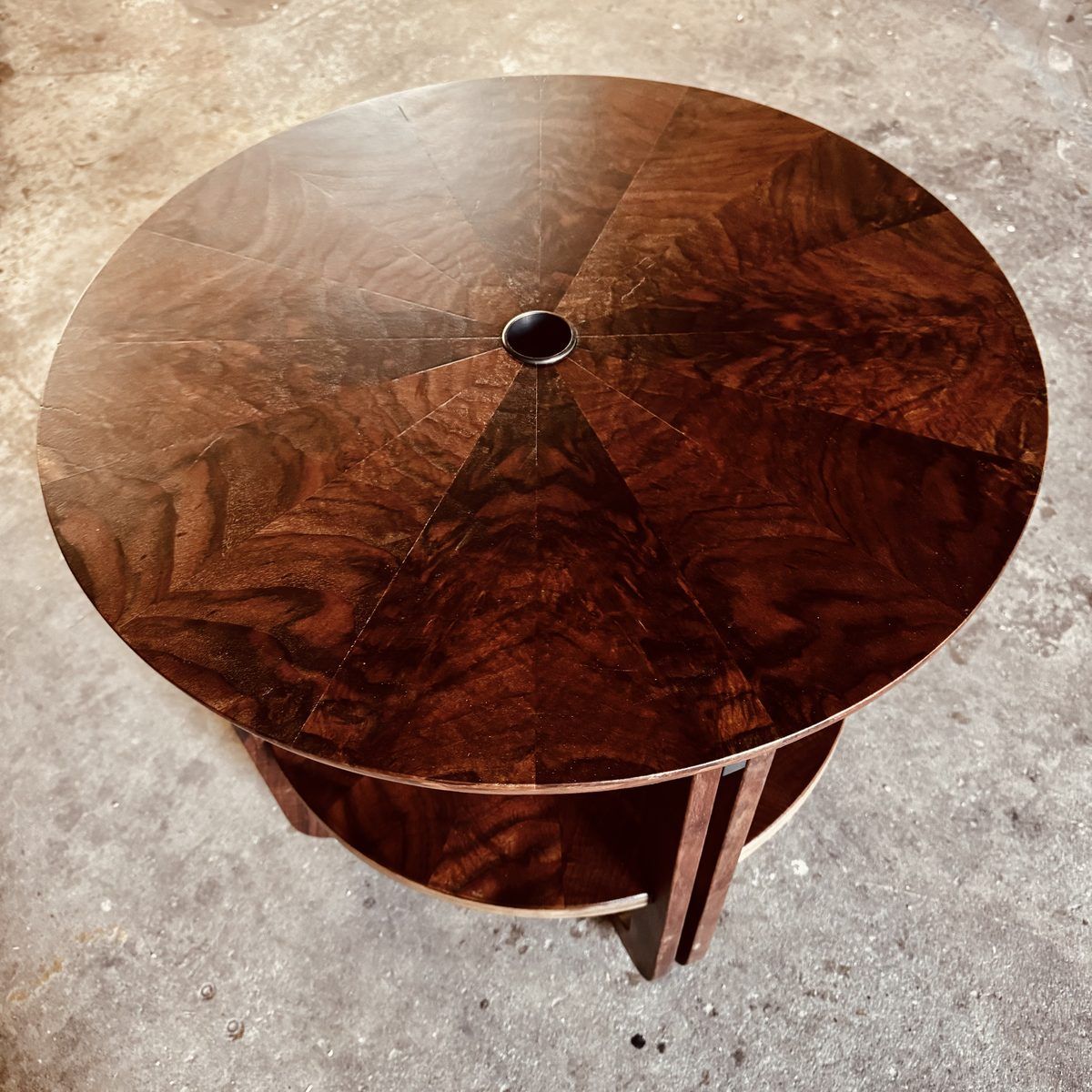 Round claro walnut table with dramatic radial crotch figure